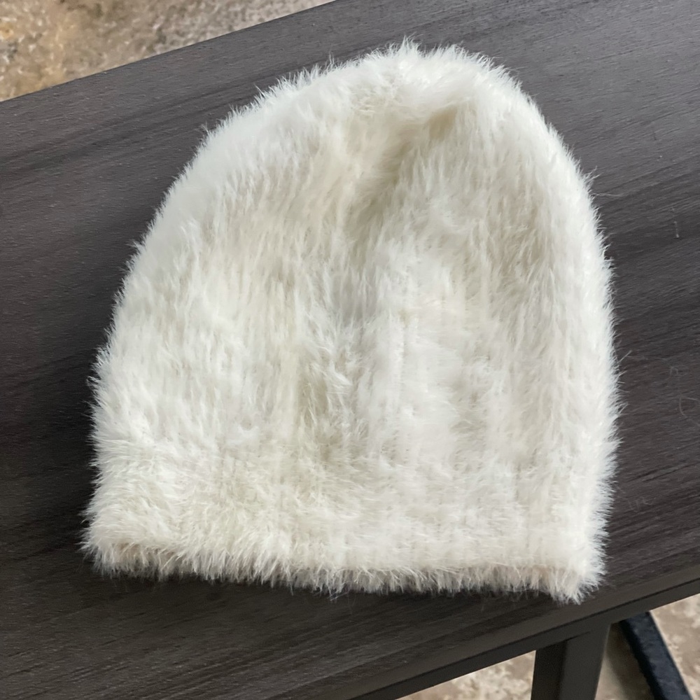 White fuzzy hat. Urban outfitters.